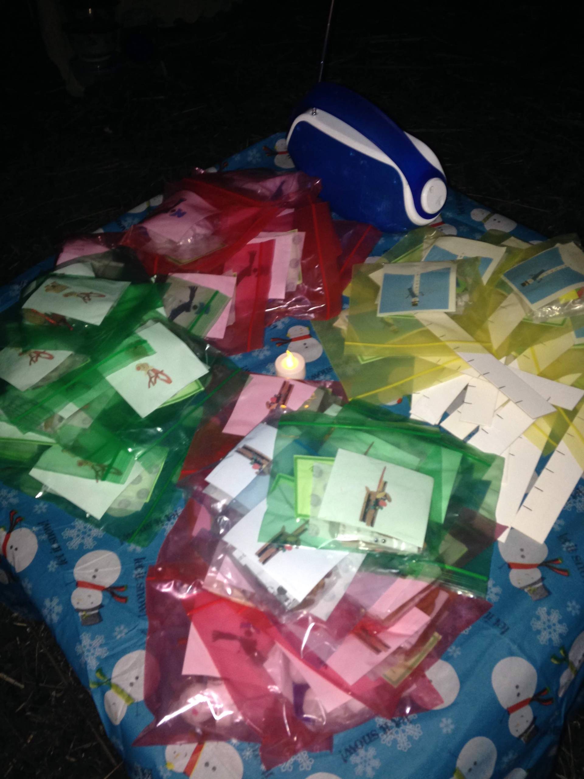 Colorful gift bags arranged on a patterned surface.